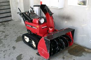 Heavy-duty walk-behind 2-stage snow blower.