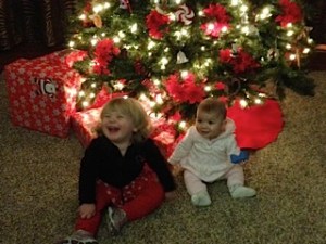 Lucy (The Goblin) and Scarlett (Pikachu) by the Christmas Tree