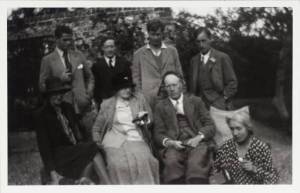 The Bloomsbury Group in the garden at Charleston, Vanessa Bell and Duncan Grant’s home, in 1930. Standing from left to right: Angus Davidson, Duncan Grant, Julian Bell and Leonard Woolf. Seated: Virginia Woolf, Margaret Duckworth, and Clive and Vanessa Bell. From the Tate Archive.